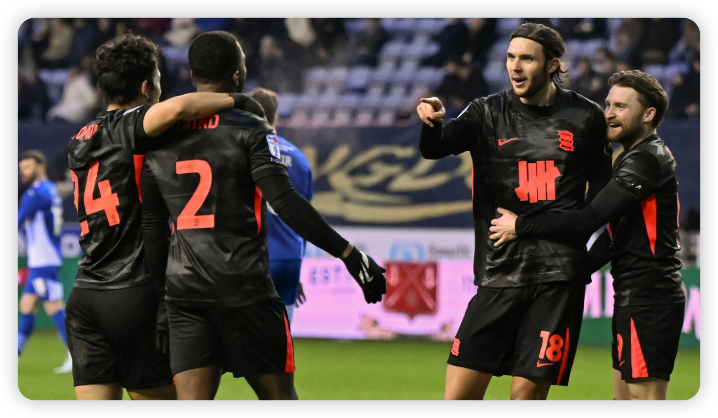 Alfie May's Brace Propels Blues to Top Spot